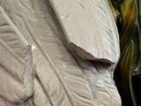 a statue of a woman holding a fish in her hands