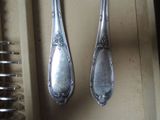 two spoons and a fork on a table