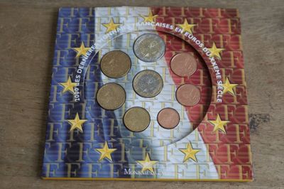 a picture of a picture of a book with coins on it