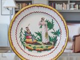 a plate with a picture of a woman and a man on it
