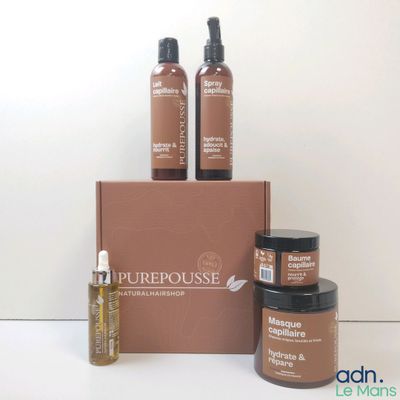 trois bouteilles de produits Purehousee posées sur un carton