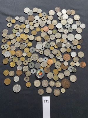 some coins are scattered on a table with a price tag