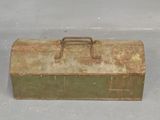 an old metal tool box sitting on the floor