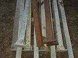 several pieces of wood sit on top of a wooden bench