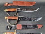 five different types of knives are lined up on a table