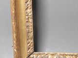 an antique gold frame with a decorative pattern on the edge