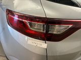 a close up of a car with a sticker on it ' s tail light