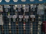 a metal rack with many items on it in a store