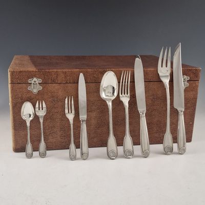 a wooden box with a set of silverware on it