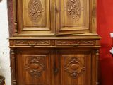 a large wooden cabinet in the corner of a room