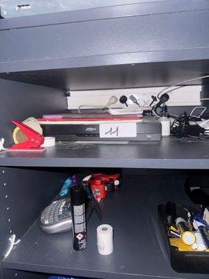 a shelf with various items on it in a room
