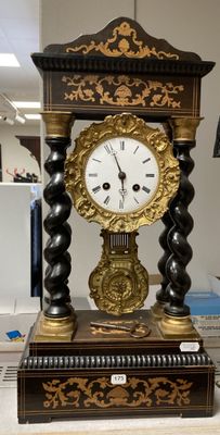 a clock that is sitting on a table in a room