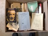 a box full of books that are sitting on the floor