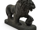 statue of a lion with a ball in its paws on a white background