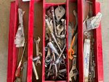 many tools in a red box on the floor
