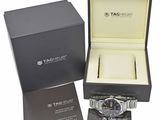 the tag heuer watch is in a black box with a tag on it
