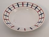 a white plate with red, blue and white stripes on it
