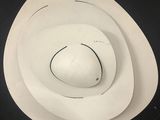 a picture of a white cowboy hat on a black background
