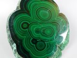 a close up of a piece of green agite with a white background