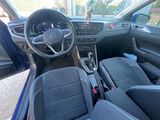 the interior of a car with a steering wheel, dashboard, and dashboard controls
