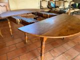 a table that has a bench on it in a room
