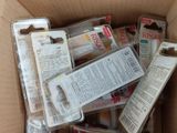 a cardboard box filled with assorted items in it
