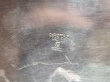a close up of a metal pan with a handle