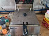 an image of a counter top with a fryer on it