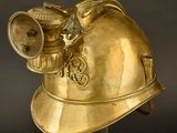 helmet of a fireman with a helmet on top of it ' s head