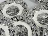 six black and white plates with a picture of animals on them