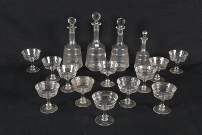 an image of a group of wine glasses and decanters on a black background