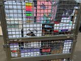 a metal cage with a bunch of books in it