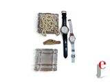 a watch, bracelets, and other items on a white surface