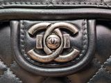 chanel black quilted leather handbag with silver cc logo