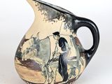 un vase orné d'une peinture représentant un homme dans une calèche