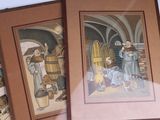 three framed pictures of a man and a woman in a wine cellar