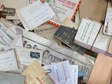 a pile of old letters and envelopes on the floor