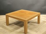 an image of a wooden coffee table on a parquet floor