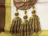 a picture of a brown and white scarf with tassels on it