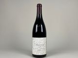 a bottle of wine that is sitting on a table