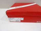 a red box with a white ribbon on top of it