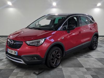 a red opel suv parked in a room with a checkered floor