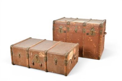 two old suitcases sitting next to each other on a white surface