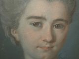 portrait of a woman in a white dress with a blue background