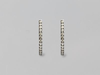 a pair of diamond hoop earrings