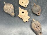 several pieces of ancient artifacts are sitting on a metal surface
