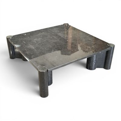 a metal table with a tree in the middle of it