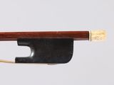 an image of a violin bow with a wooden stick sticking out of it