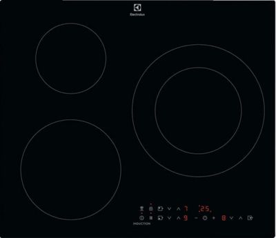 une cuisinière noire à trois brûleurs