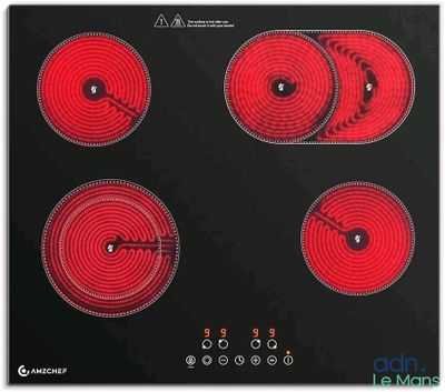une image représentant une plaque de cuisson noire et rouge à quatre feux